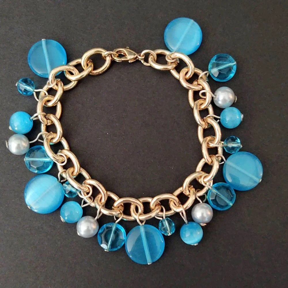 Blue bead and faux pearl charm style bracelet